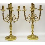 A pair of brass Louis XIII Style candelabrums with 4 branches designed as stylized bird’s heads.