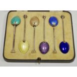 A cased set of six coloured Guilloché enamel teaspoons by Henry Clifford Davis dated 1936