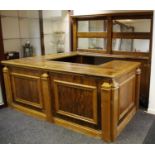 A large light oak effect mirror back bar.