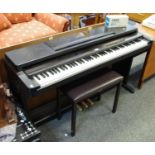 A Yamaha Clavinova CLP-560 elctric keyboard;