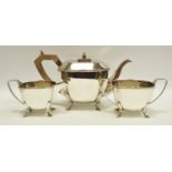 An Art Deco silver three piece tea setting by Gladwin Ltd dated 1931 1,