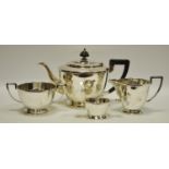 An early 20th century Walker & Hall silver plated four piece tea set comprising tea pot, sugar bowl,