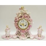 A French porcelain clock garniture cherub pediment,