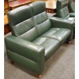 An Ekornes Stressless reclining two seat sofa.