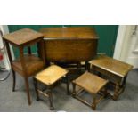 An oak barley twist drop leaf table; an oak stool; an oak jardiniere stand drawer to under tier;