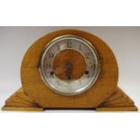 An Art Deco oak mantel clock