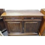 A Victorian mahogany sideboard moulded top, two short drawers over two door cupboard, plinth base.