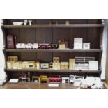 Dolls house furniture including a metal kitchen range, fireplaces, brass double bed, kitchen units,