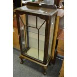 An early 20th century oak display cabinet with key