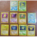 Pokemon cards - ten holofoil shinty edition 1990's collectos cards including Zapdos, Scyther,
