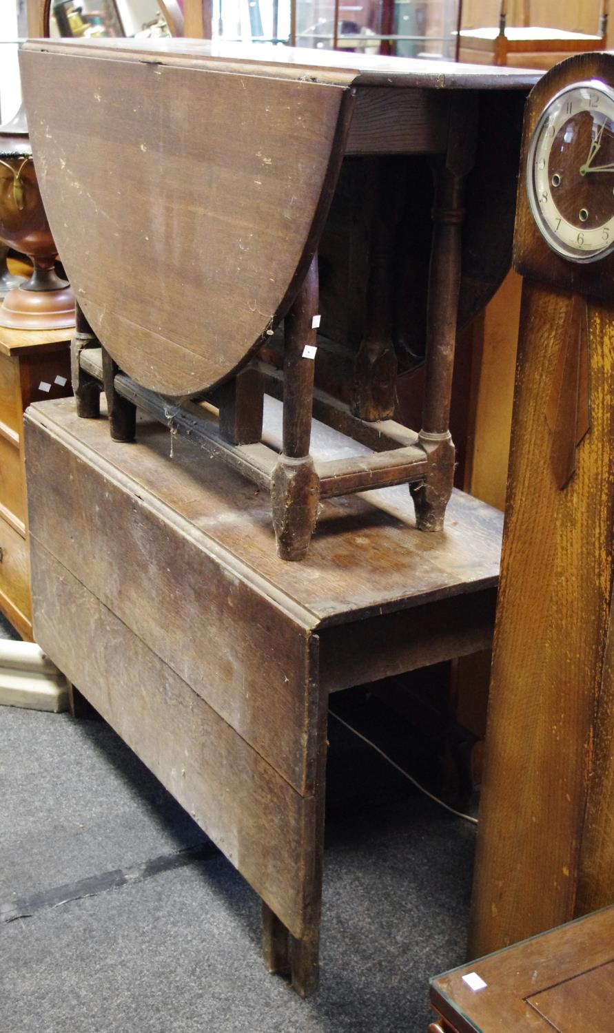 A George III oak oval dropleaf table, turned supports; another, one leaf.