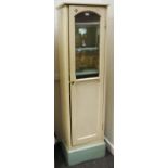 A painted 20th century slender kitchen/mess cabinet with arched glazed panel enclosing six