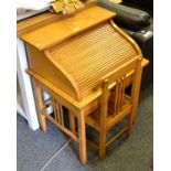 An early / mid 20th century satin wood child's tambour fronted desk and chair