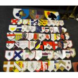 Seventy one hand painted carnival float shield shaped armorial plaques,