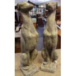 A pair of reconstituted greyhounds, sitting proud,