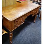 A Georgian mahogany desk, one long drawer to frieze flanked by two short, turned legs,