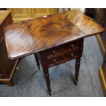 A Victorian flame mahogany Pembroke table, the fall front with two blind drawers,