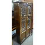 A 1940's oak leaded glass bookcase