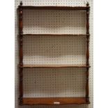 A Victorian mahogany wall shelf, four shaped shelves,