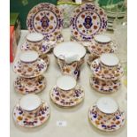 A Derby style part tea service including cups, saucers, tea plates, milk,