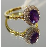 An 18ct gold amethyst and diamond cluster ring, size M1/2, 3.