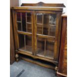 A 1930's/40's oak bookcase, glazed panel doors.