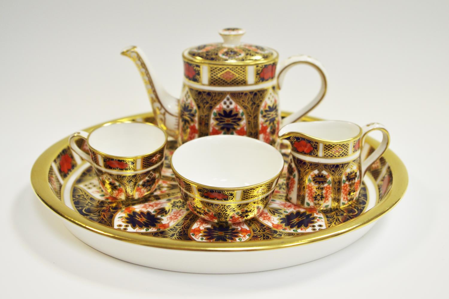 An Royal Crown Derby 1128 Imari pattern miniature tea set on tray, teacup, teapot,