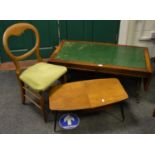 A Reprodux drop leaf tooled leather inlaid coffee table;