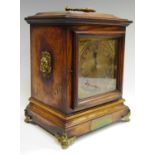 A late Victorian oak mantel clock,