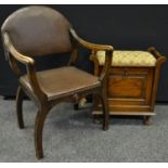 An early 20th century oak piano stool,