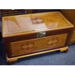 An oriental camphor wood chest.