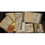 Five stamp albums including loose stamps