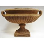 Interior Design - a cast iron effect twin handled gadrooned oval urn