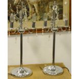 A pair of contemporary chrome three branch lamp bases with cut glass droplets and shades (2)