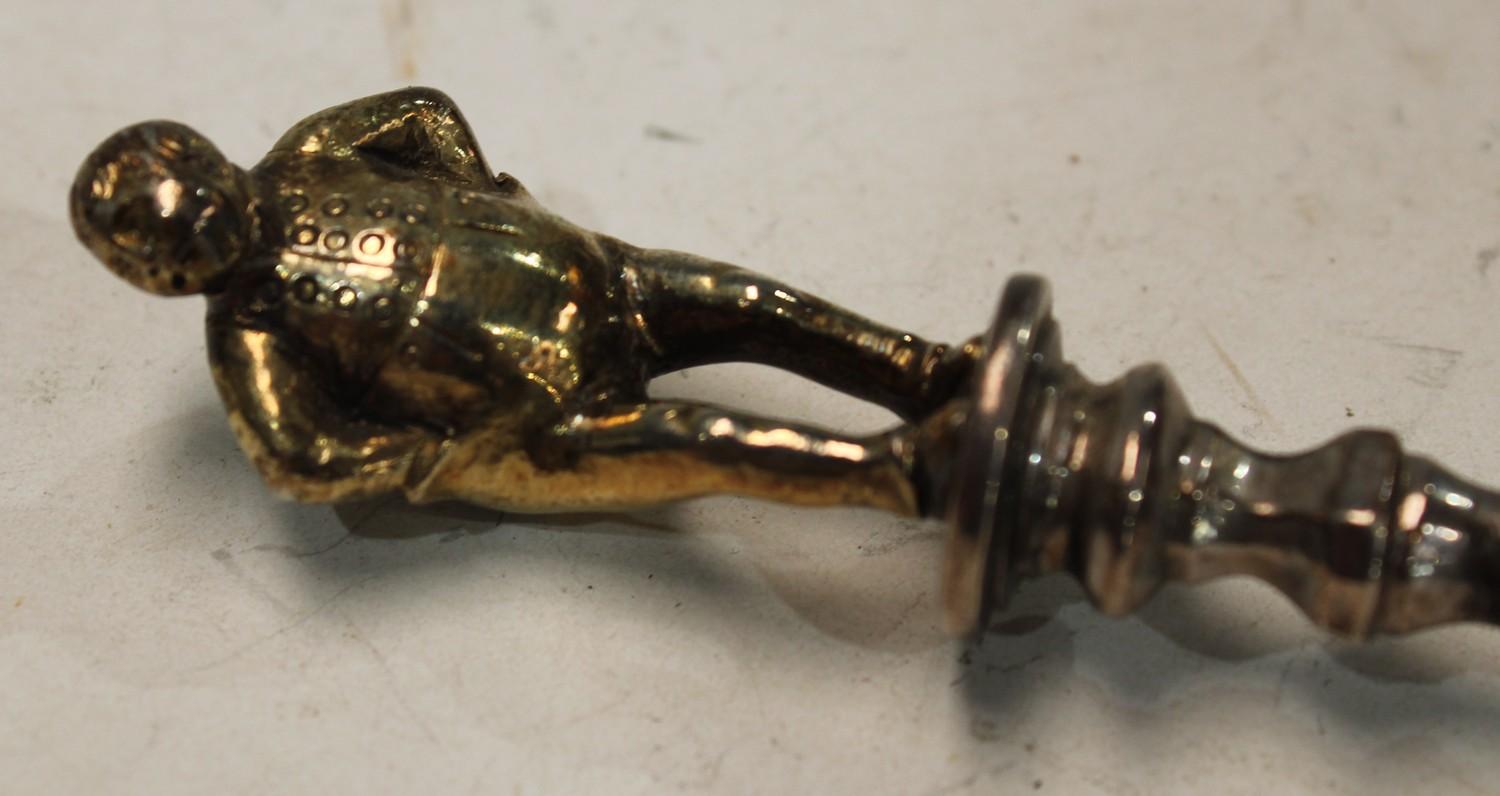 A mid-Victorian parcel-gilt silver 'Apostle' table spoon, the figural finial cast as a rotund - Image 2 of 2