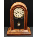 A mahogany domed case eight day mantel clock, glazed door, enamel dial with Roman numerals, twin
