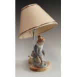 An lamp as a kneeling boy, on alabaster base