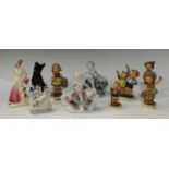 A pair of Sitzendorf figural table salts, putto; a Russian model bear; Goebel Hummel figures; an Art