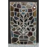 An Art Nouveau stained glass panel, a vase of flowers