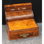 A late Victorian walnut desk-top stationery companion cabinet, the upper stage with day/date/month