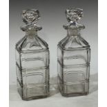 A pair of 19th century glass square decanters, each fluted with girdles, panelled shoulders,