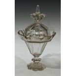 A 19th century glass lantern-shaped pedestal sweetmeat vase and cover, slightly tapering, panelled