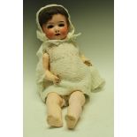 A Heubach Koppelsdorf bisque head doll, number 320.3, made in Germany, composite body