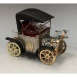 A novelty musical whisky decanter and glasses, the caddy as a vintage car, by Lucky Gold, Terada