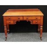 A Victorian mahogany desk/dressing table, shallow half gallery, moulded slightly oversailing