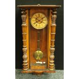 A mahogany Vienna wall clock, Roman numerals, key and pendulum, 98cm high