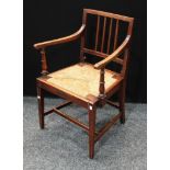 A 'George III' Country House elm and mahogany open armchair, drop-in rush seat, tapered square legs,