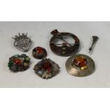 A Scottish silver intertwined crown and heart brooch, marked Monarch, hallmarks rubbed; a Scottish