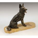 An Art Deco model of an Alsatian, seated on a marble base, marked H Moli, 30cm high