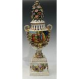 A 19th century German porcelain urnular pedestal vase and cover, painted with Deutsche Blumen and